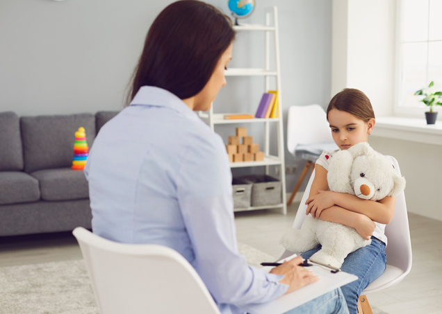 Clinician interviewing a nervous child